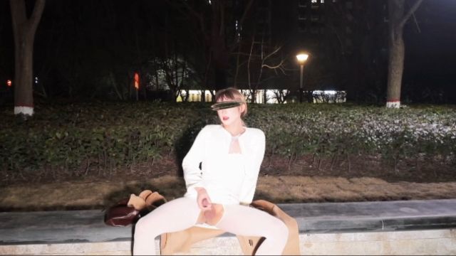 Trans girl masturbates and cums outdoors in white open-crotch stockings